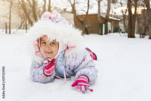 Portrait of a little girl smiling in the snow