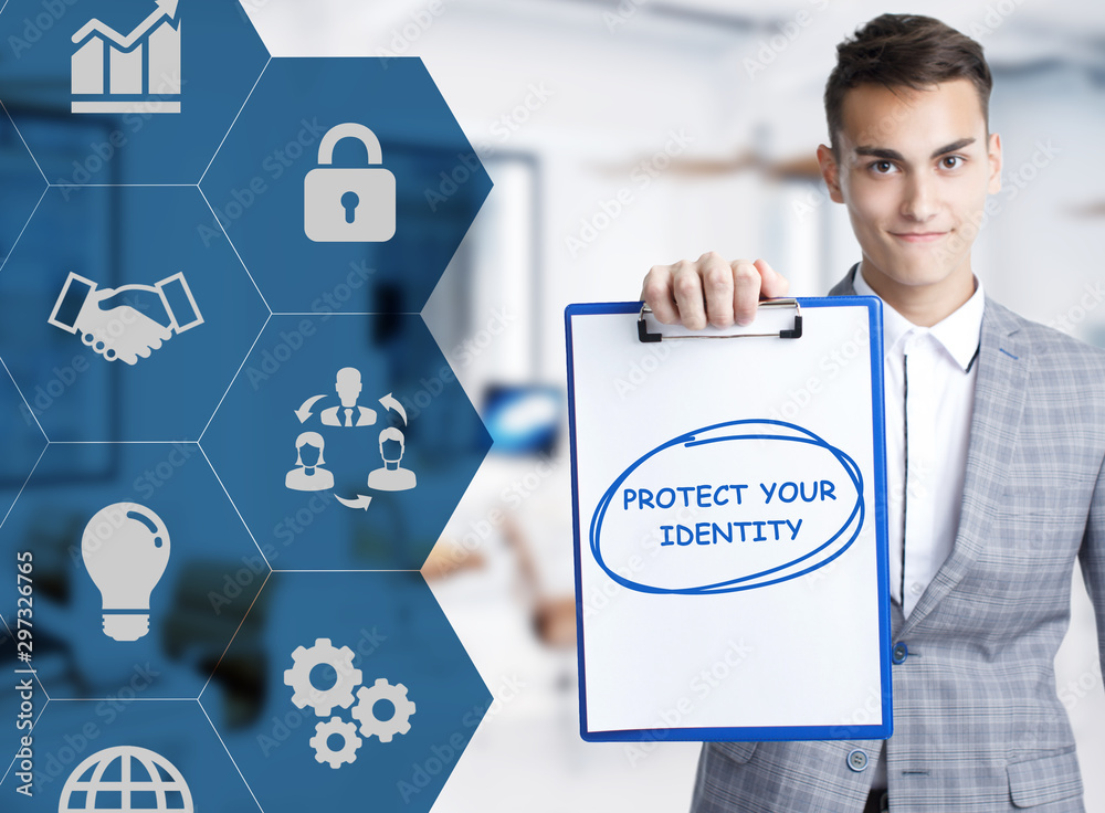 Business, technology, internet and network concept. Young businessman shows a keyword: Protect your identity Business, technology, internet and network concept. Young businessman shows a keyword: Protect your identity