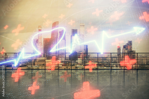 Heart hologram with city view from roof top background. Double exposure. Education concept.