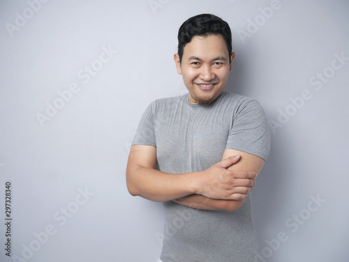 Young Funny Asian Man Smiling Happily