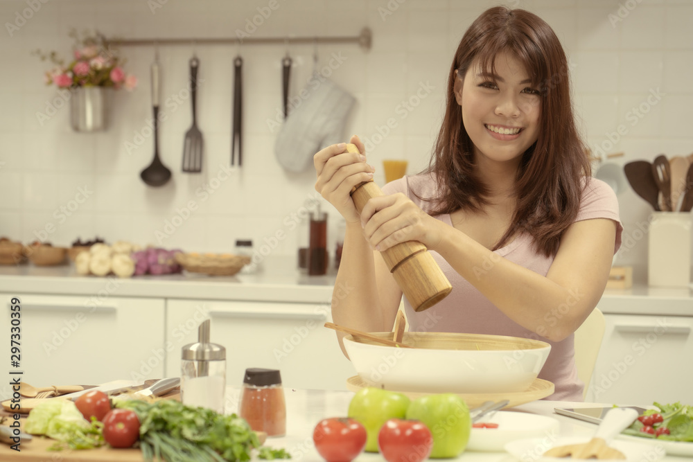 Young beautiful woman take care her health by eating salad and fruit instead of eating fat and calories Young beautiful woman take care her health by eating salad and fruit instead of eating fat and calories