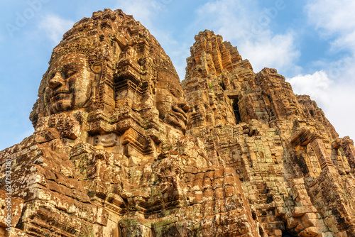 Awesome bottom view of towers with stone faces, Bayon temple