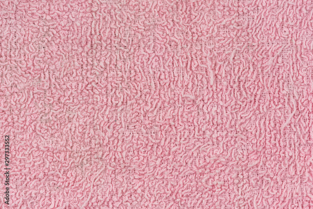 Texture of pink knitted textile material background Texture of pink knitted textile material background
