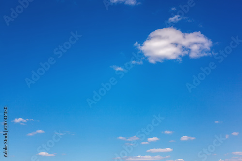 Blue sky with white clouds as a background