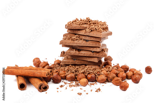 Chocolate tiles and nuts on white background