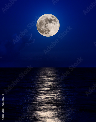 full moon over the ocean