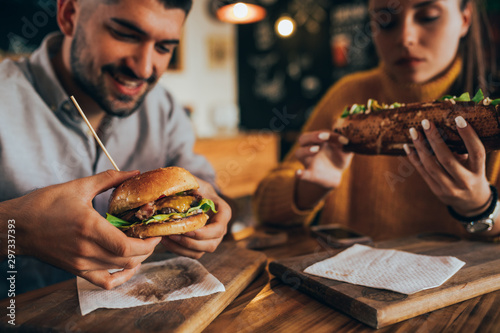 couple having fun eating in food corner bar