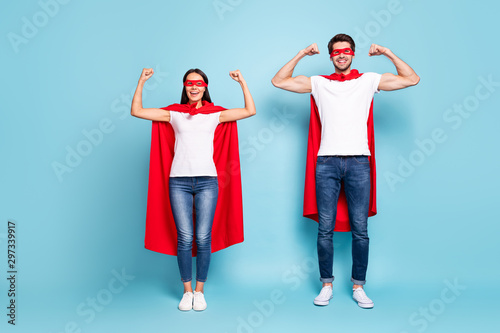 Full length body size view of nice attractive content cheerful sporty people wearing red hero look showing arm muscles ready to rescue isolated on bright vivid shine vibrant blue turquoise background