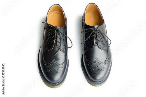 A genuine leather black brogues isolated on a white background. Smart casual style shoes