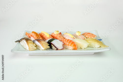 Japanese sushi nigiri of Salmon, Shrimp, Saba, Tako, Squid, Engawa on ceramic plate