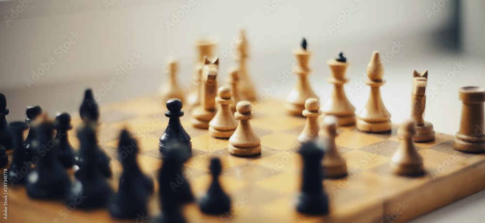Wooden chess pieces on the chessboard. Wooden chess pieces on the chessboard.