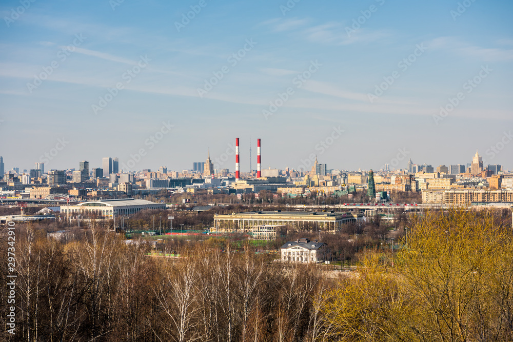 View of downtown of Moscow and bank of Moskva River , view from the at the Sparrow Hills, formerly called Lenin Hills in Moscow, Russia. View of downtown of Moscow and bank of Moskva River , view from the at the Sparrow Hills, formerly called Lenin Hills in Moscow, Russia.