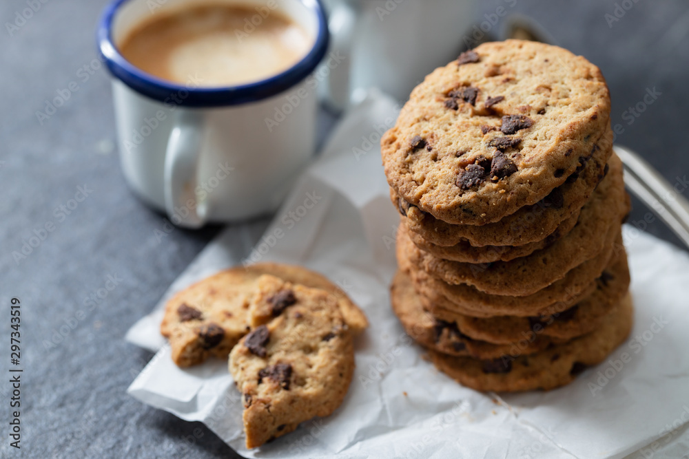 coffee and cookies with chocolate chips on ceramic background coffee and cookies with chocolate chips on ceramic background