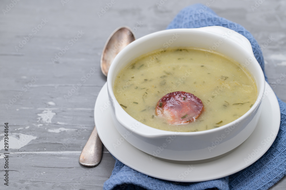 typical portuguese soup caldo verde in white bowl on ceramic background typical portuguese soup caldo verde in white bowl on ceramic background