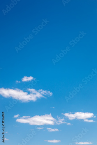 Blue sky with white clouds as a background