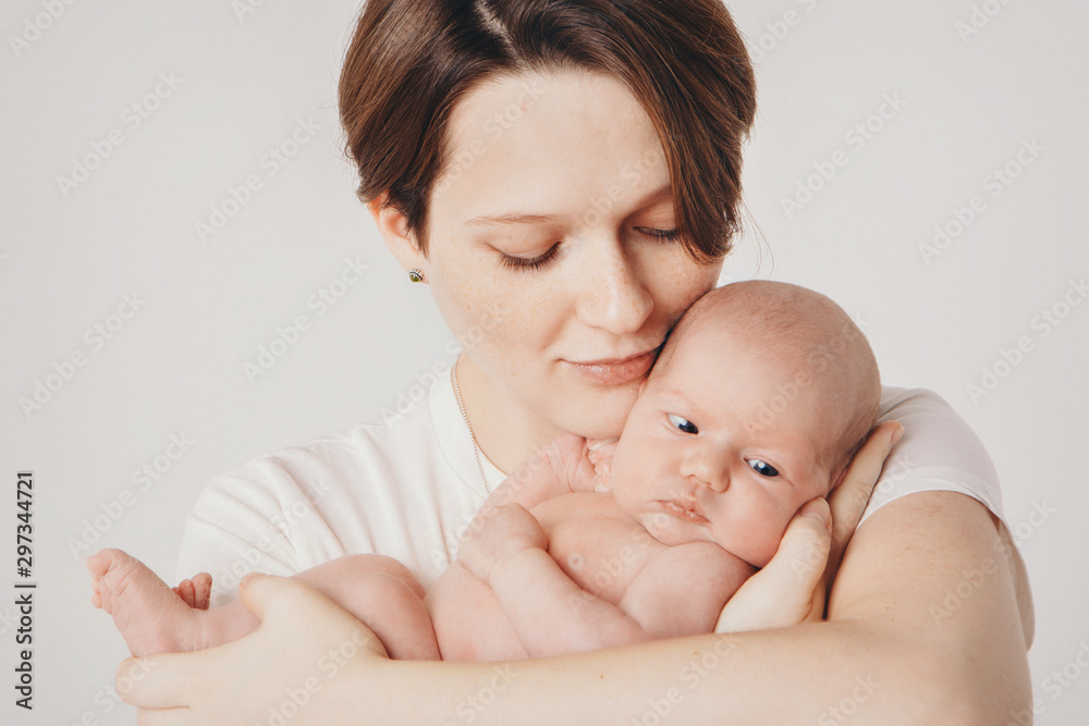 photo in black and white: the mother holds her son in her arms. Family portrait: a woman with a child. Health care concept: healthy family photo in black and white: the mother holds her son in her arms. Family portrait: a woman with a child. Health care concept: healthy family