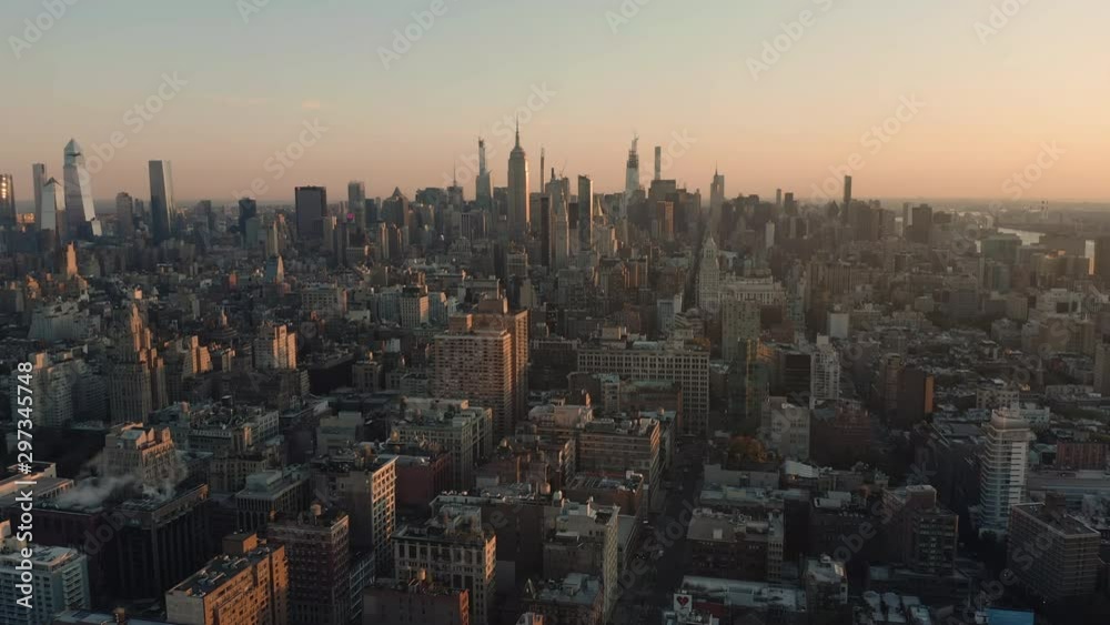 Aerial view of Manhattan Midtown buildings, early morning, skyline with skyscrapers on horizon, light effect applied. New York city