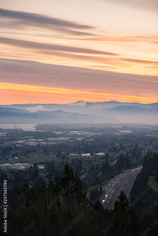 Morning commuters at foggy sunrise over the Columbia River, Portland Oregon