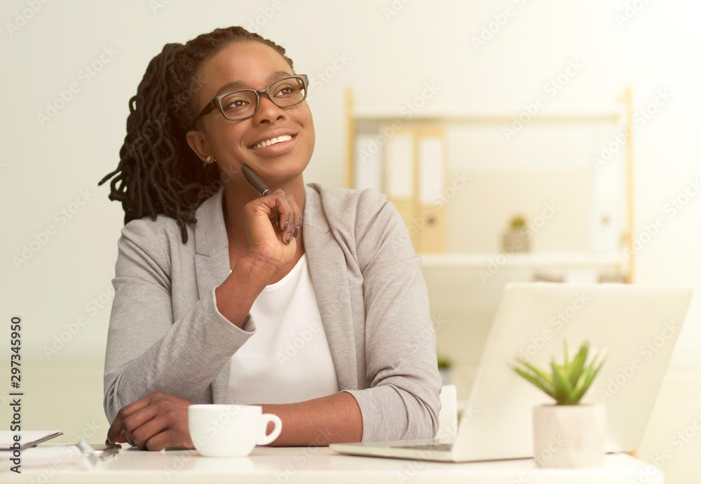 African American Girl Sitting Touching Chin Dreaming In Modern Office African American Girl Sitting Touching Chin Dreaming In Modern Office