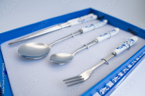 Set of chinese traditional cutlery spoon fork chopstick teaspoon with blue texture patern isolated on white background