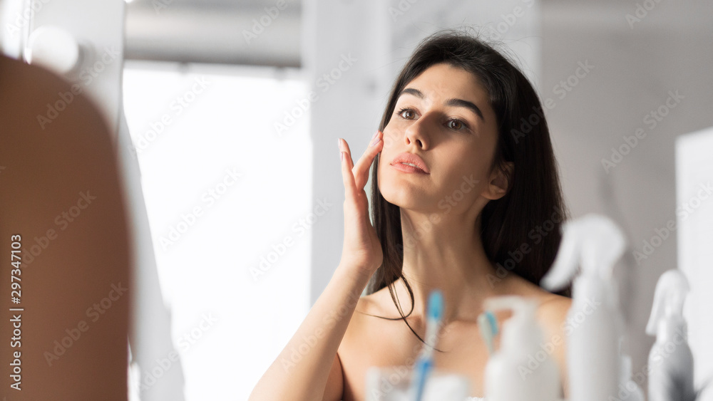 Girl Touching Face Standing In Bathroom, Panorama Girl Touching Face Standing In Bathroom, Panorama