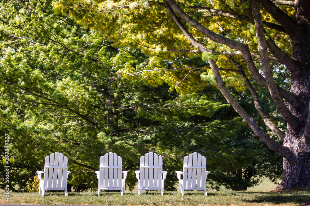 Adirondack Chairs on Hilltop Overlooking Field of Trees. Calming Nature Image. Summer Goals. Adirondack Chairs on Hilltop Overlooking Field of Trees. Calming Nature Image. Summer Goals.
