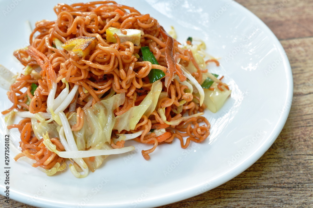 fried instant noodles with tofu and garlic chive on plate fried instant noodles with tofu and garlic chive on plate