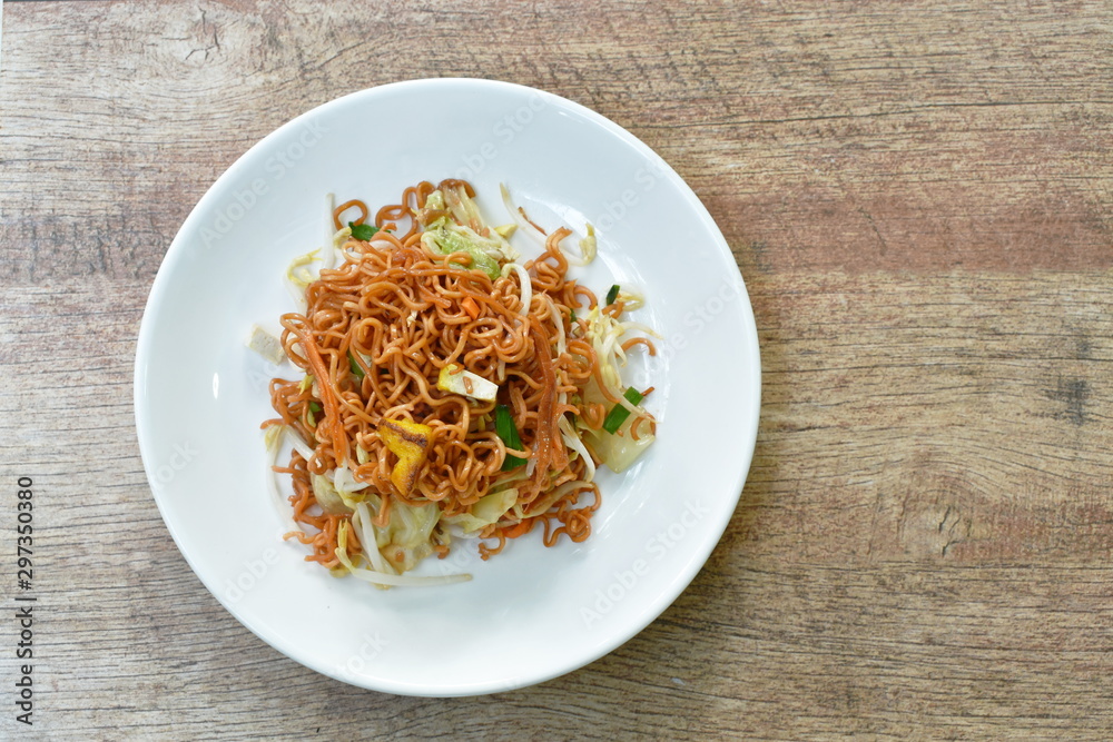 fried instant noodles with tofu and garlic chive on plate fried instant noodles with tofu and garlic chive on plate