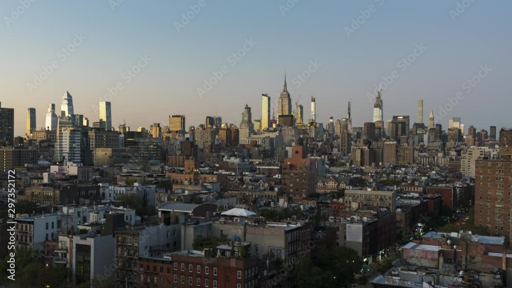 New York City day to night time lapse, modern city with lights, view at Empire State Building from Lower Manhattan New York City day to night time lapse, modern city with lights, view at Empire State Building from Lower Manhattan