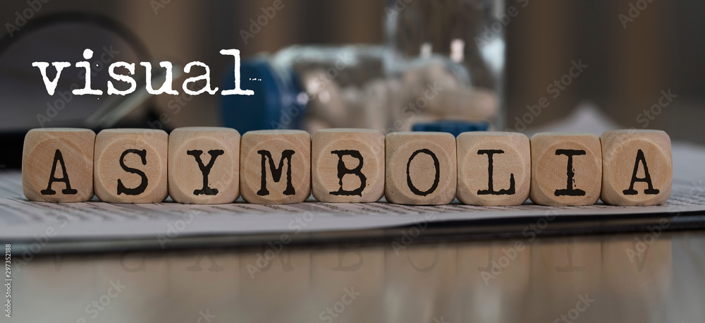 Obraz premium Words VISUAL ASYMBOLIA composed of wooden dices.