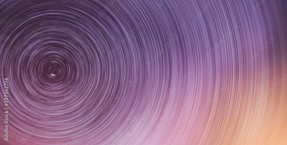 Fototapeta premium Beautiful starry sky with star trails orientation on the north star. Space background. Abstract long exposure background.