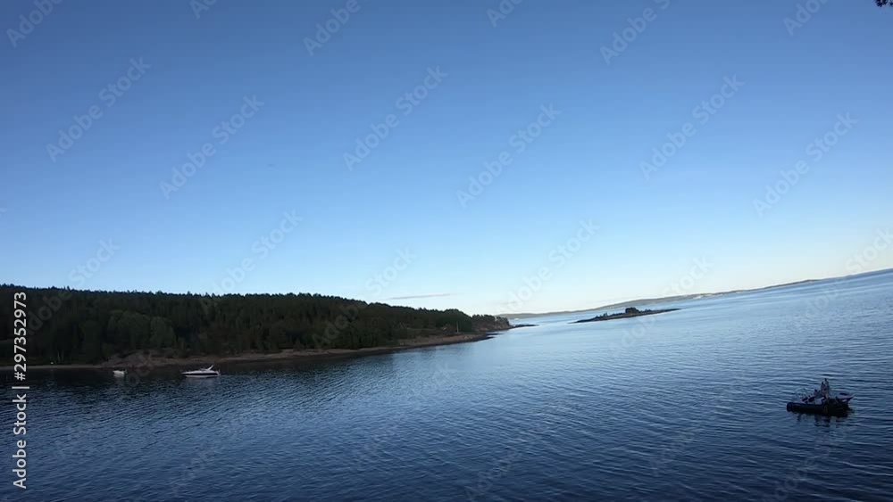 Looking from a cliff to the lake and the shore on the other side - wide angle Looking from a cliff to the lake and the shore on the other side - wide angle