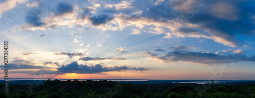 Sunlight with dramatic sky. sunset on dark background.Vivid orange cloud sky.