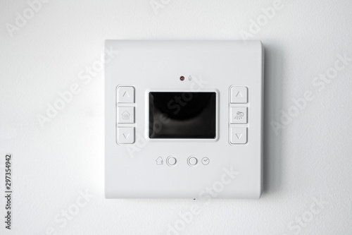 Modern programmable thermostat water heater (boiler) for setting the room temperature. Smart home.