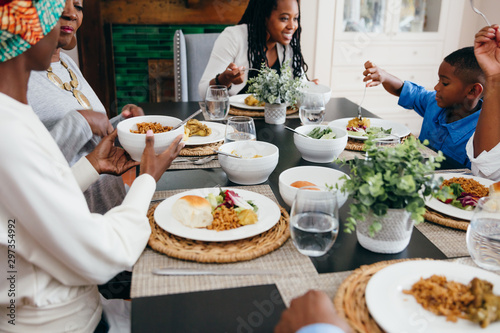 Family enjoying Kwanzaa dinner together photo