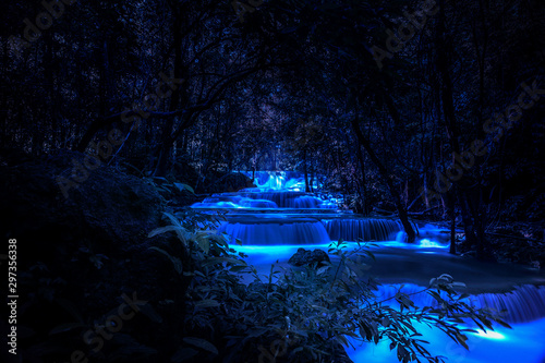 Beautiful waterfall nature scenery of colorful at a night deep tropical fantasy jungle
