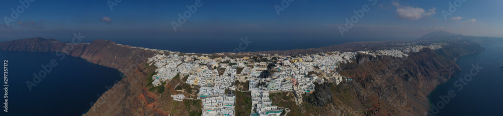 Aerial drone photo of iconic picturesque village of Imerovigli built on top of steep hill with amazing views to Caldera and Santorini island, Cyclades, Greece Aerial drone photo of iconic picturesque village of Imerovigli built on top of steep hill with amazing views to Caldera and Santorini island, Cyclades, Greece