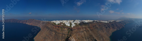 Aerial drone photo of iconic picturesque village of Imerovigli built on top of steep hill with amazing views to Caldera and Santorini island, Cyclades, Greece