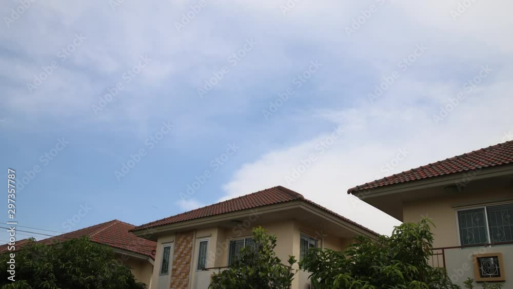 House with Sunny blue sky, nature white clouds. Beautiful cloud flying in blue sky, 4k time lapse. House with Sunny blue sky, nature white clouds. Beautiful cloud flying in blue sky, 4k time lapse.