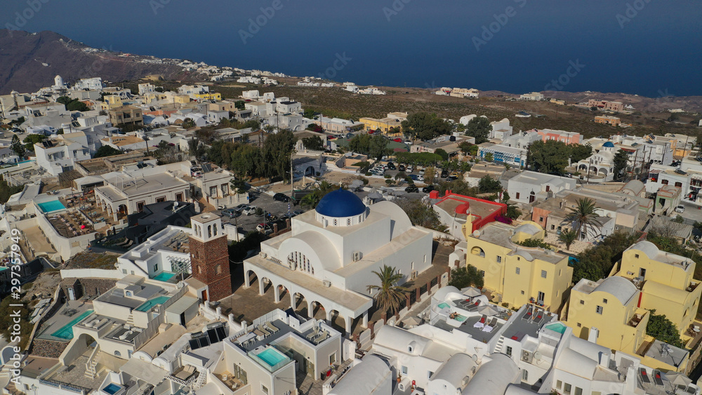 Aerial drone photo of iconic picturesque village of Imerovigli built on top of steep hill with amazing views to Caldera and Santorini island, Cyclades, Greece Aerial drone photo of iconic picturesque village of Imerovigli built on top of steep hill with amazing views to Caldera and Santorini island, Cyclades, Greece