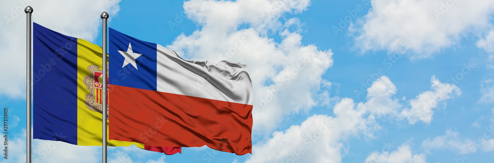 Fototapeta premium Andorra and Chile flag waving in the wind against white cloudy blue sky together. Diplomacy concept, international relations.