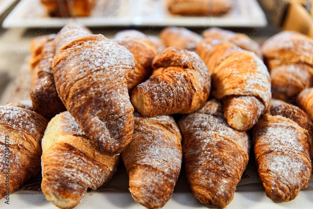 Sweet french croissant pastry with jam and cream