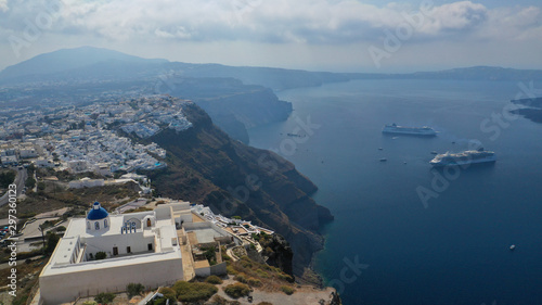 Aerial drone photo of famous church of Agios Nikolaos in Firostefani area with beautiful view to Caldera, Santorini island, Cyclades, Greece