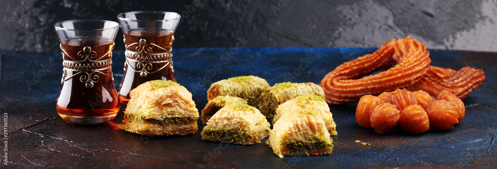 Baklava on table. Middle eastern or arabic dishes. Turkish Dessert Baklava with pistachio on rustic table