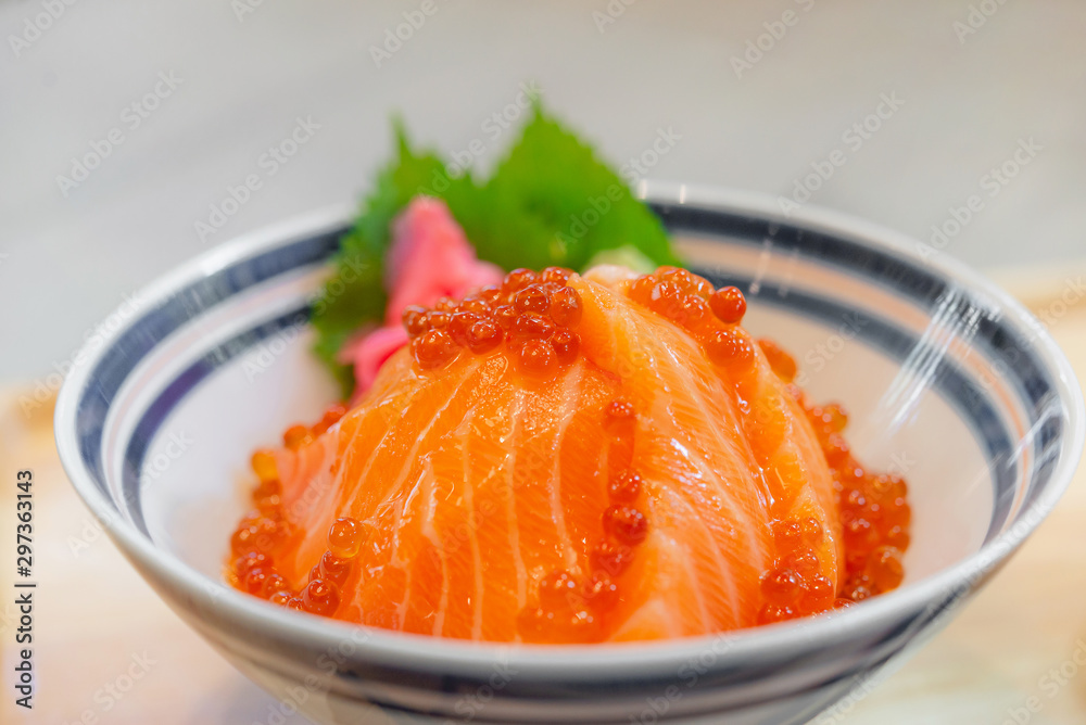 Japanese food Salmon sashimi, salmon's egg (ikura), shredded radish and slice ginger with japanese rice donburi,Salmon don. Japanese food Salmon sashimi, salmon's egg (ikura), shredded radish and slice ginger with japanese rice donburi,Salmon don.