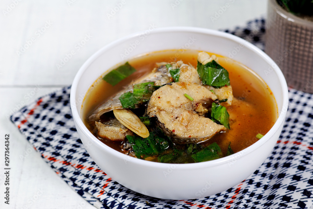 Spicy snake head fish soup ,Thai hot and sour soup call Tom yum pla Spicy snake head fish soup ,Thai hot and sour soup call Tom yum pla