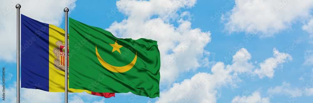 Andorra and Mauritania flag waving in the wind against white cloudy blue sky together. Diplomacy concept, international relations. Andorra and Mauritania flag waving in the wind against white cloudy blue sky together. Diplomacy concept, international relations.
