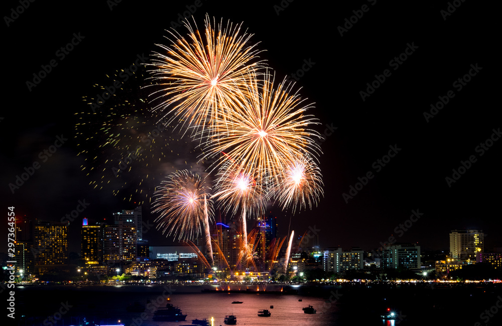 Happy new year fireworks over cityscape at night.holiday celebration festival