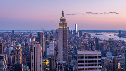 Wandcirkels Empire State Building Manhattan in warme zonsondergangkleuren  © Marco