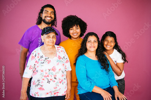 Family portrait of Latinx/Afrolatinx family in studio environment photo